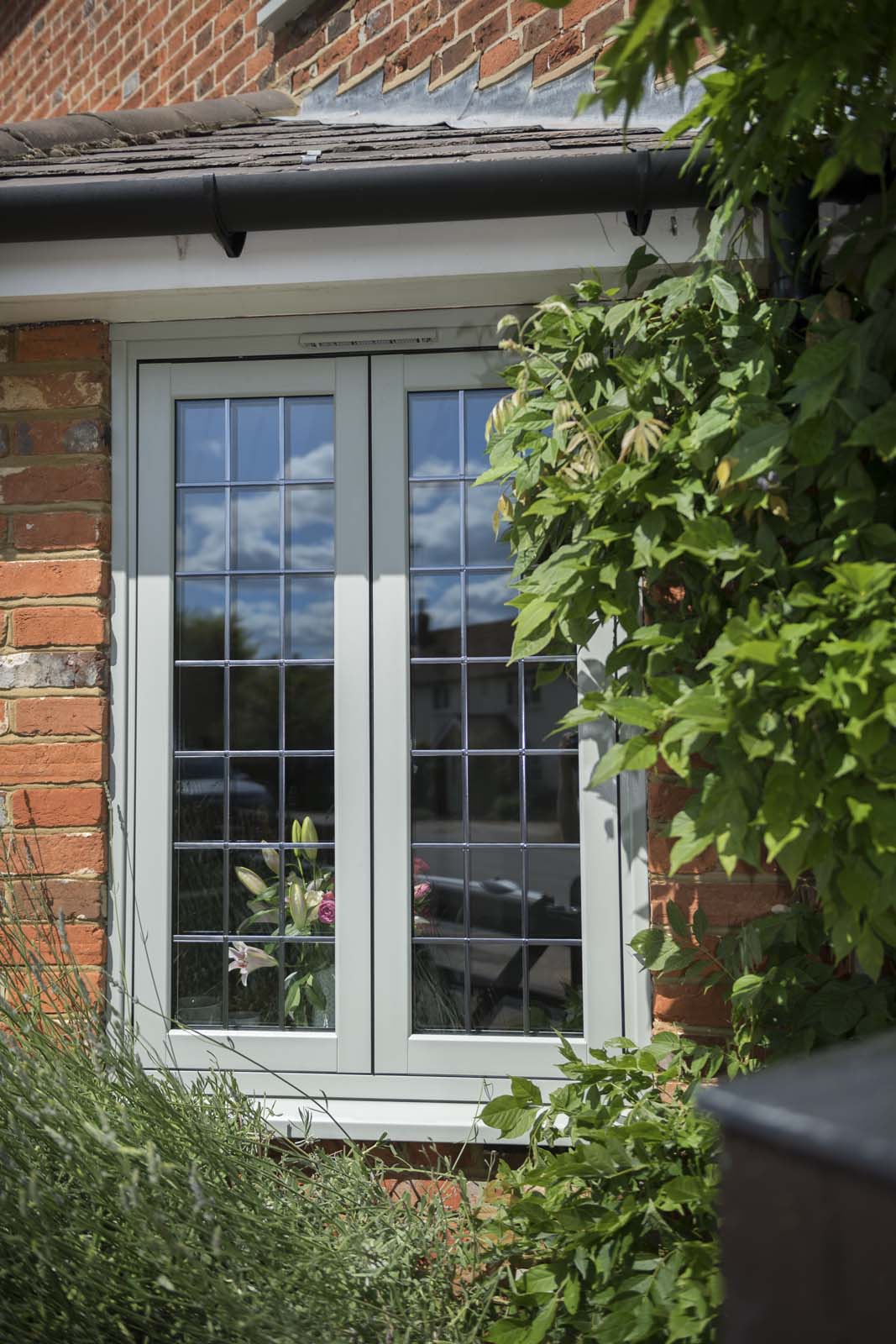 close up of flush casement window with bars in Chelmsford